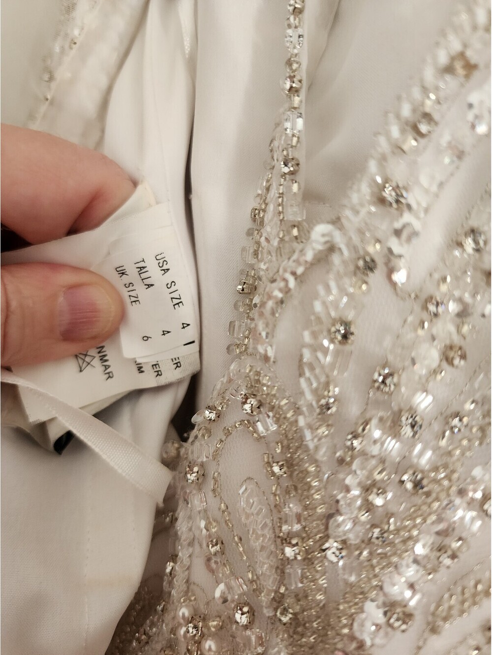 Elegant White Beaded Evening Gown with Sheer Embellished Bodice and Flowing Skit - Picture 9 of 9